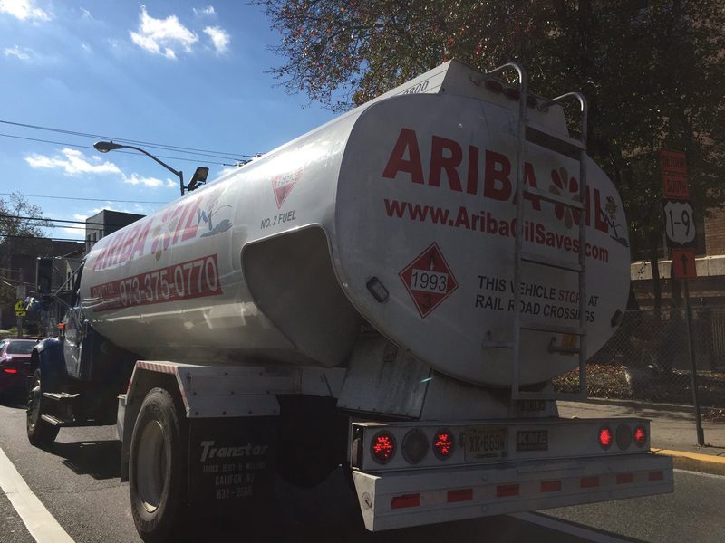 An Ariba Oil tanker truck on a New Jersey street showing the company phone number.